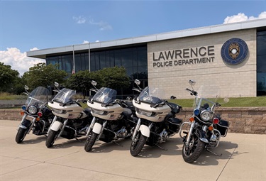 Police motorcycles parked in line outside police headquarters